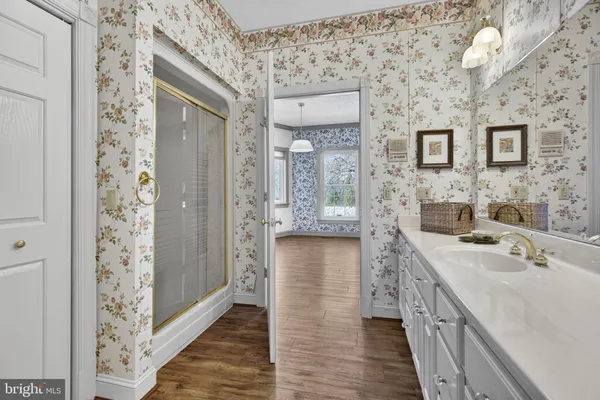 a bathroom with a sink a vanity and a mirror