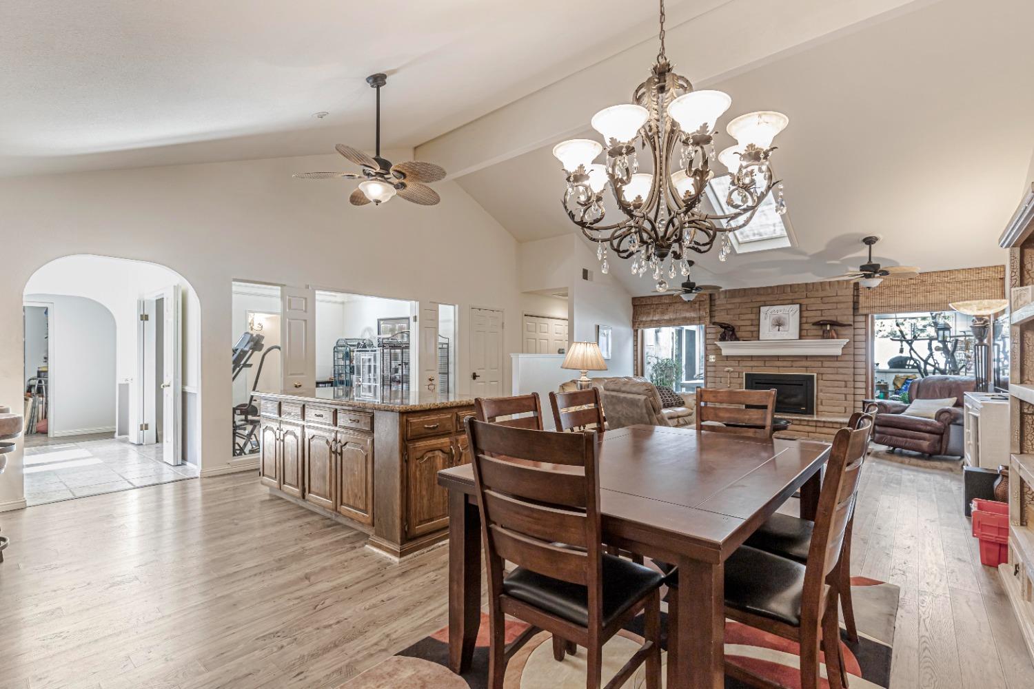 4 Seasons Court Madera, CA 93637 - Photo 5 of 18 a view of a dining room with furniture wooden floor and chandelier