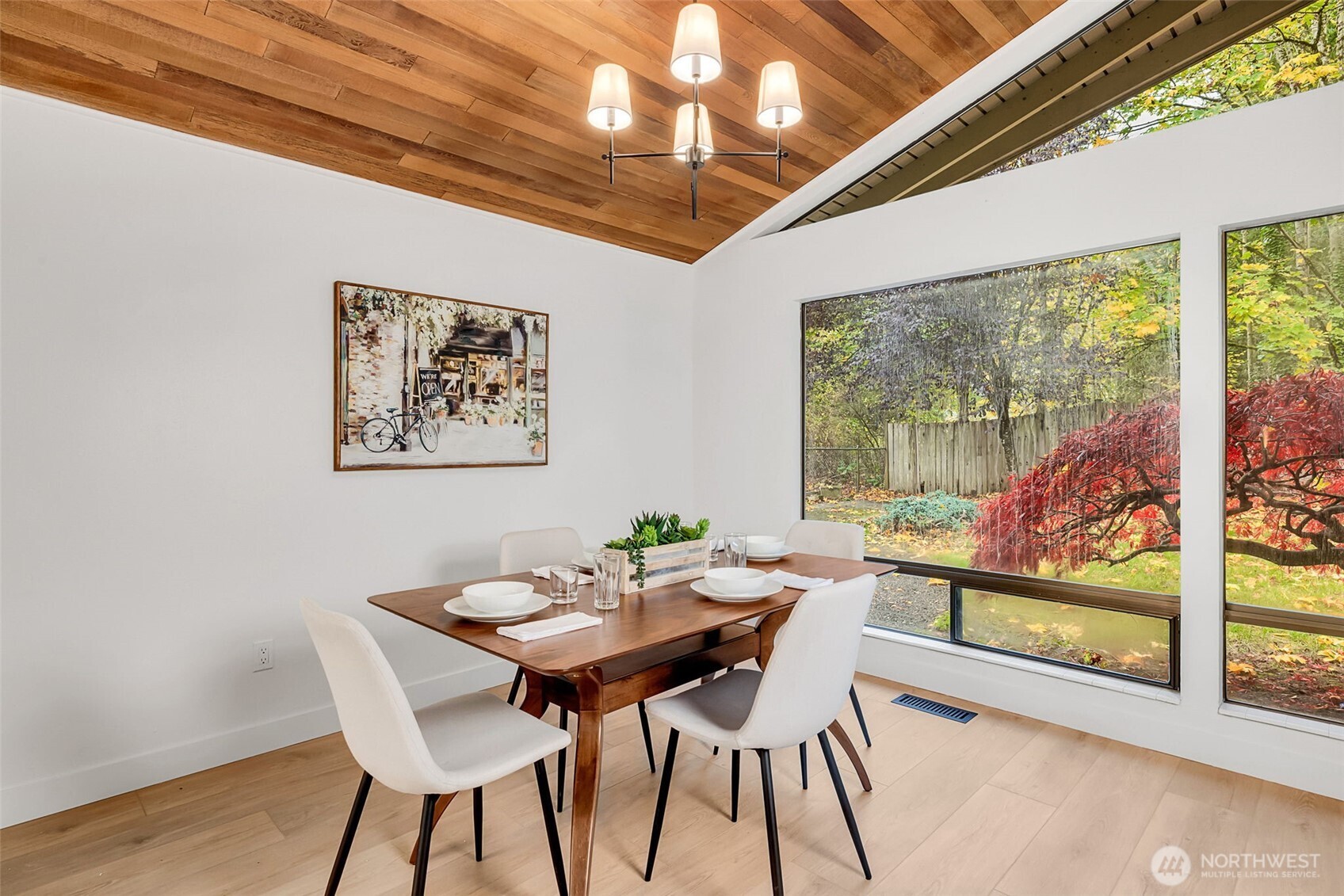 16123 Southeast 146th Place Renton, WA 98059 - Photo 12 of 40 a view of a dining room with furniture large window and wooden floor