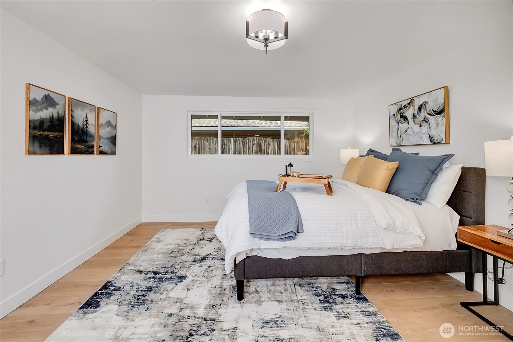 16123 Southeast 146th Place Renton, WA 98059 - Photo 26 of 40 a bedroom with a bed and a window