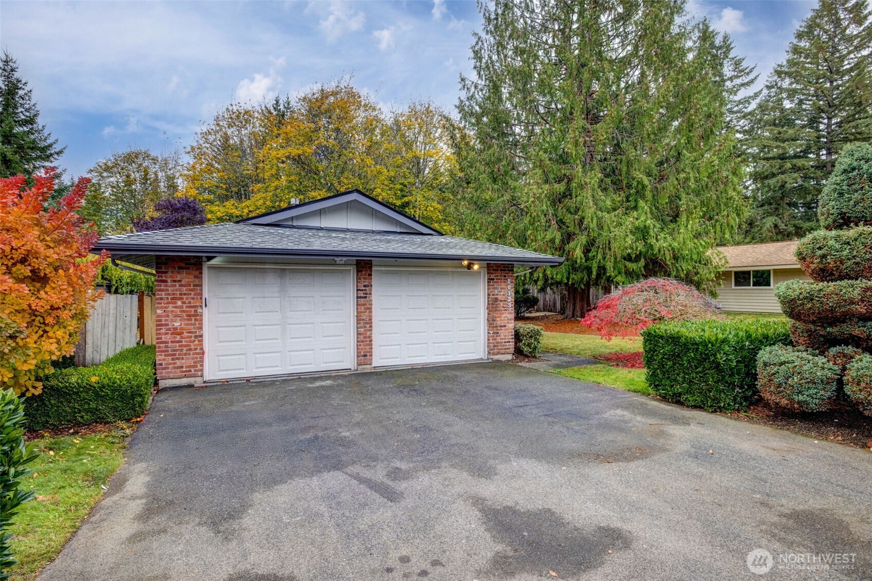 16123 Southeast 146th Place Renton, WA 98059 - Photo 3 of 40 a front view of a house with a yard and garage