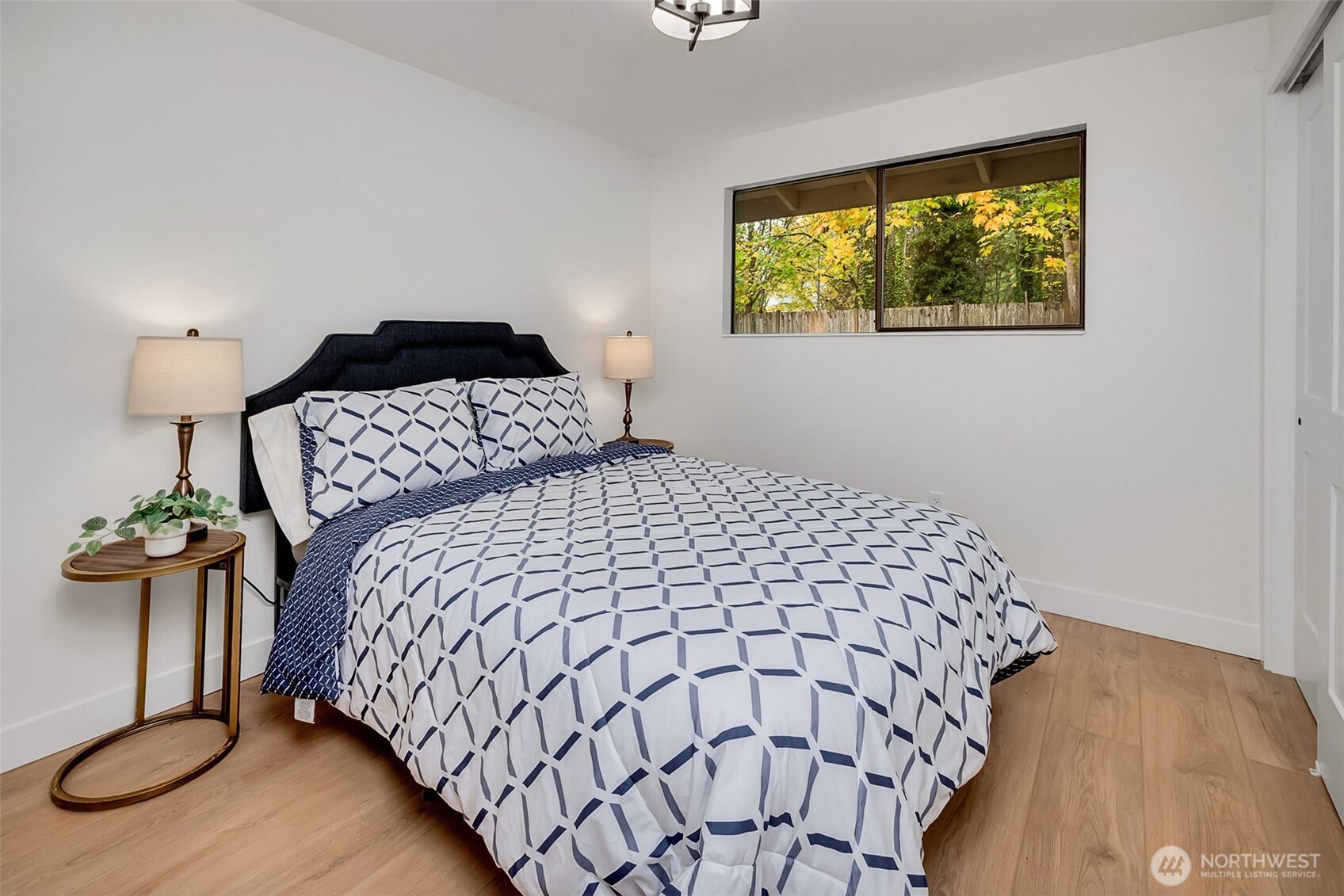 16123 Southeast 146th Place Renton, WA 98059 - Photo 31 of 40 a bedroom with bed and a window