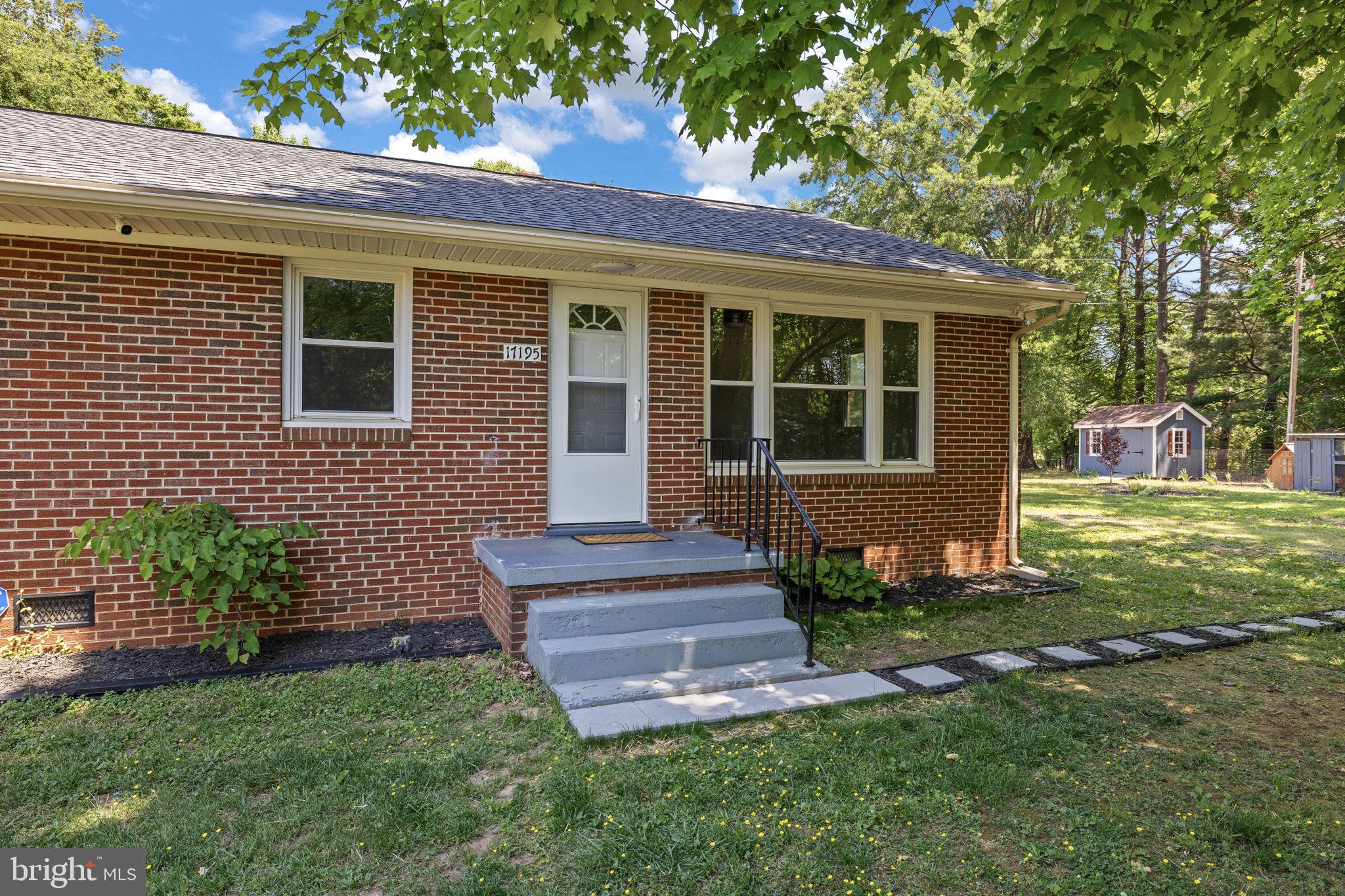 17195 Oakshade Road Orange, VA 22960 - Photo 4 of 31 Charming brick home with lush greenery.