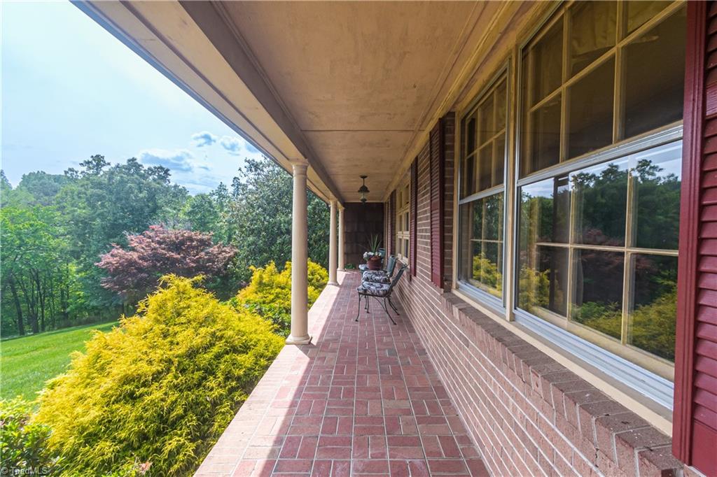 289 Reeves Mill Road Mount Airy, NC 27030 - Photo 6 of 50 Large covered front porch with brick paver floor.