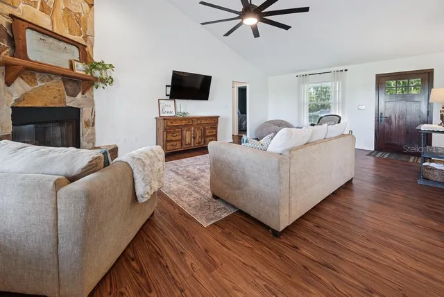 a view of a dining room with furniture wooden floor and chandelier