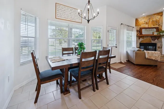 a kitchen with kitchen island white cabinets and refrigerator