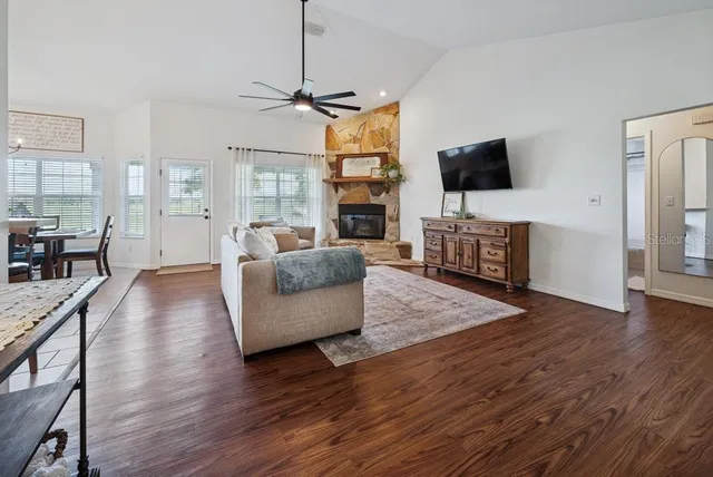 a kitchen with white cabinets appliances and a sink