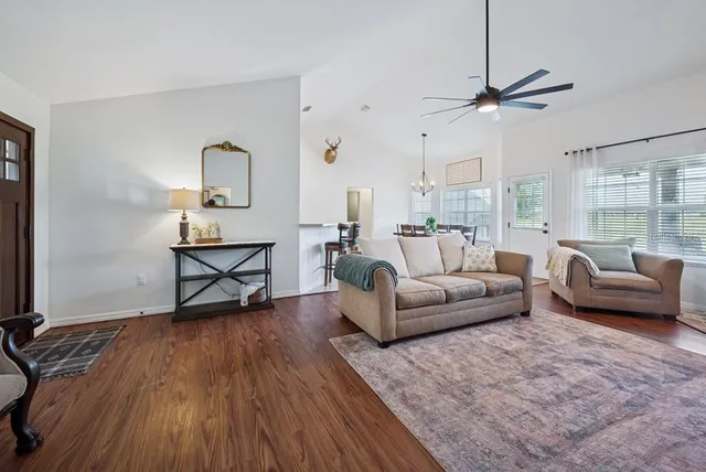 a kitchen with white cabinets stainless steel appliances and sink