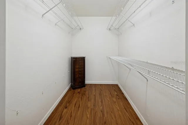 a bed room with a bed and a chandelier