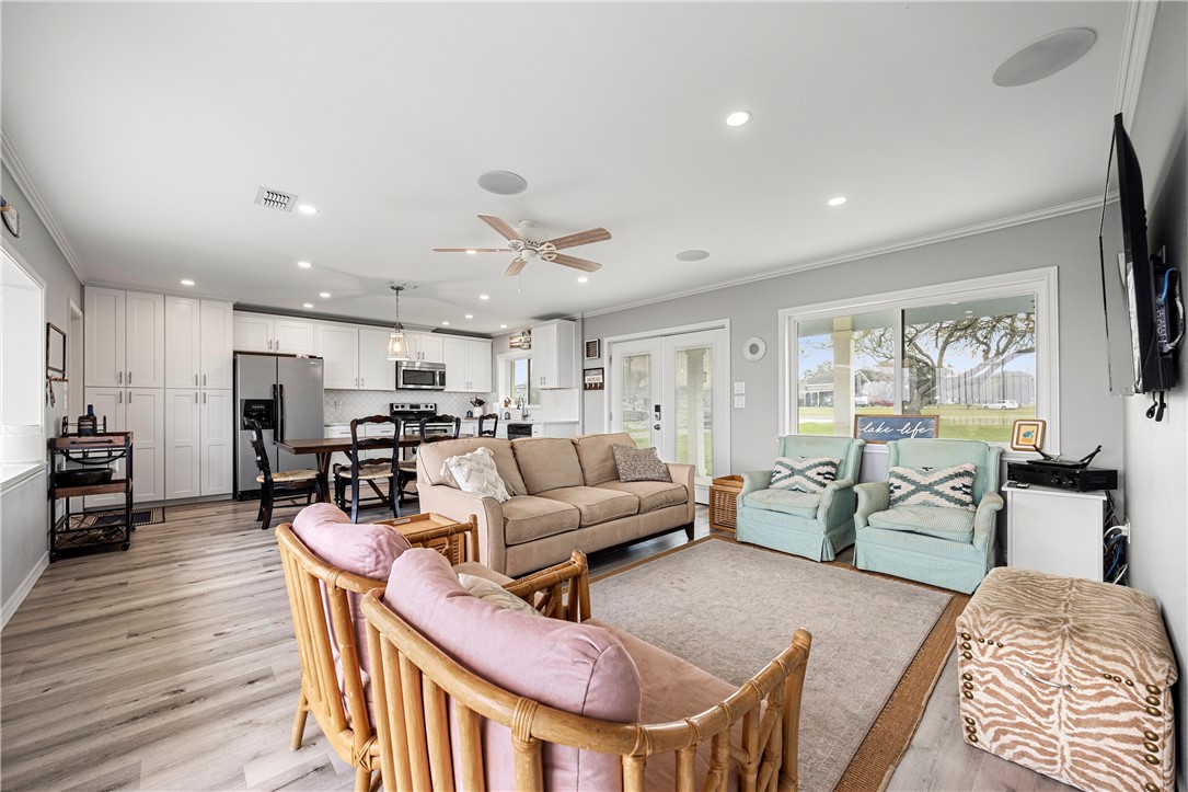 140 Zenna Drive Mathis, TX 78368 - Photo 18 of 31 a living room with furniture and a flat screen tv