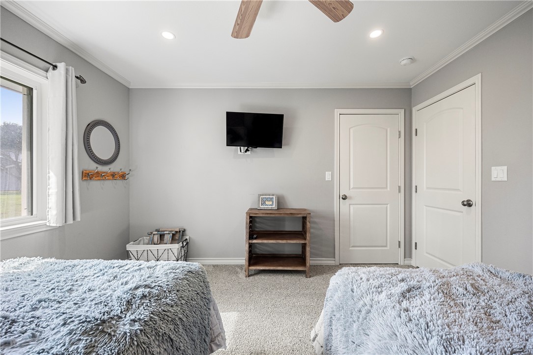 140 Zenna Drive Mathis, TX 78368 - Photo 20 of 31 a bedroom with a bed and a television