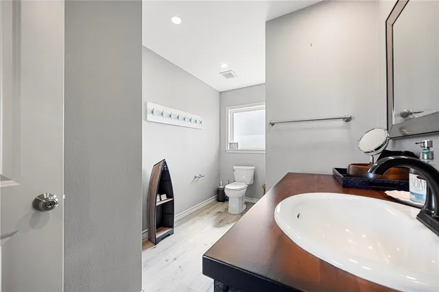 a bathroom with a sink and mirror