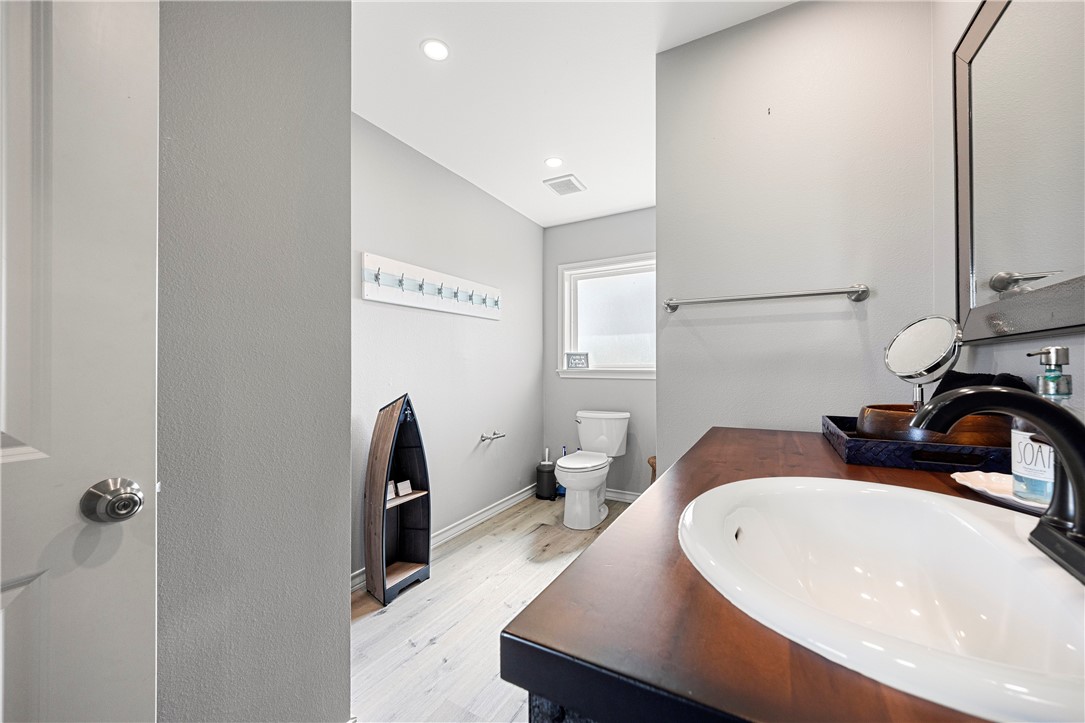 140 Zenna Drive Mathis, TX 78368 - Photo 24 of 31 a bathroom with a sink and mirror