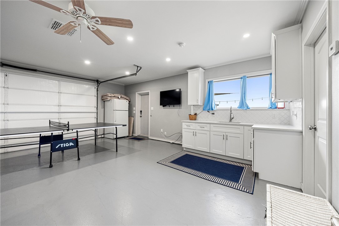 140 Zenna Drive Mathis, TX 78368 - Photo 27 of 31 a kitchen with a sink stainless steel appliances and white cabinets