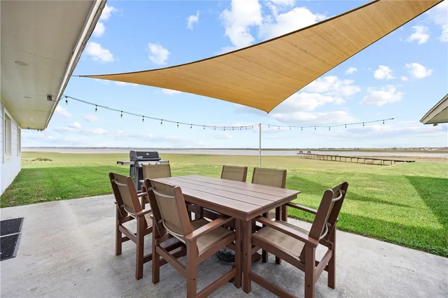 a view of an outdoor space with furniture and garden