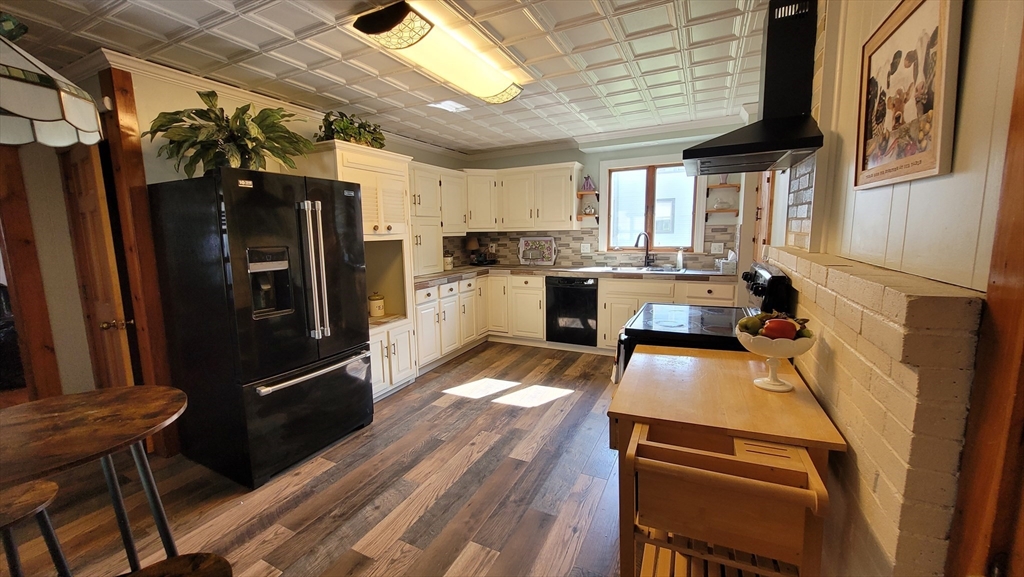 50 Grove Street Barre, MA 01005 - Photo 12 of 39 a kitchen with stainless steel appliances granite countertop a refrigerator a stove and a refrigerator