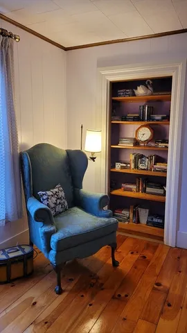 a living room with furniture window and wooden floor