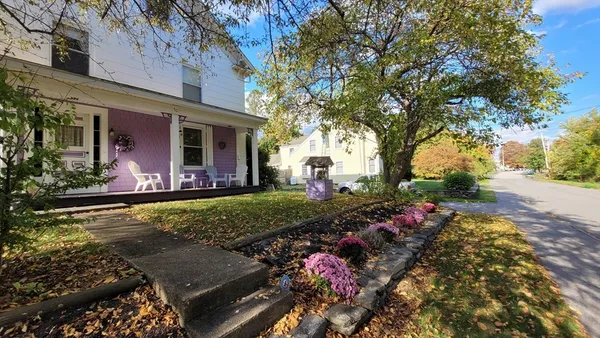 front view of a house with a yard