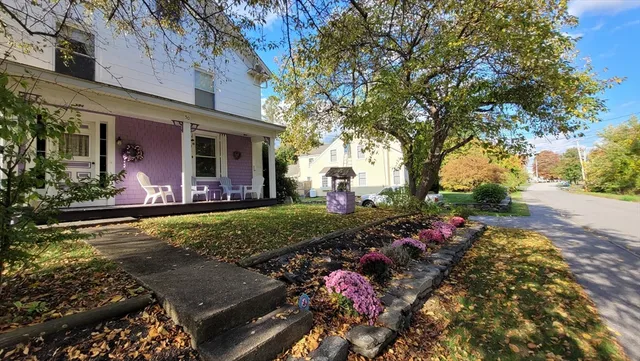 front view of a house with a yard