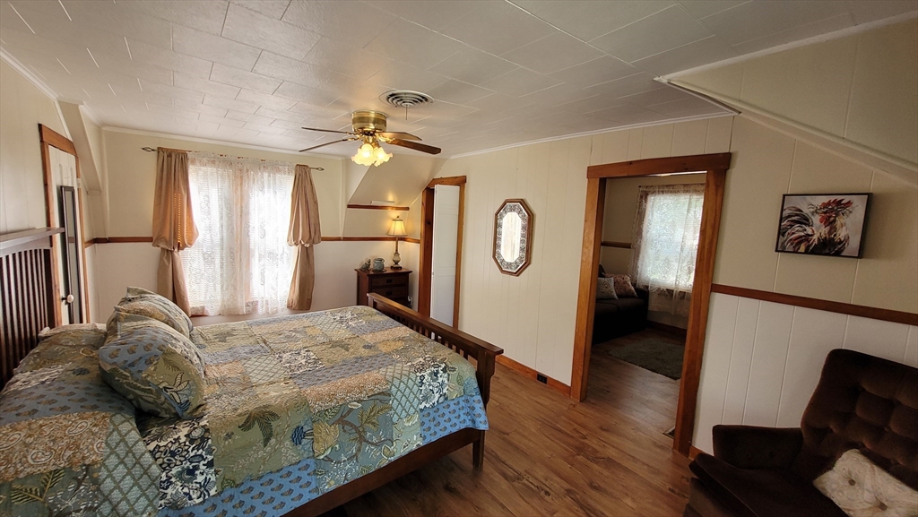 50 Grove Street Barre, MA 01005 - Photo 33 of 39 a bedroom with a bed mirror and a window