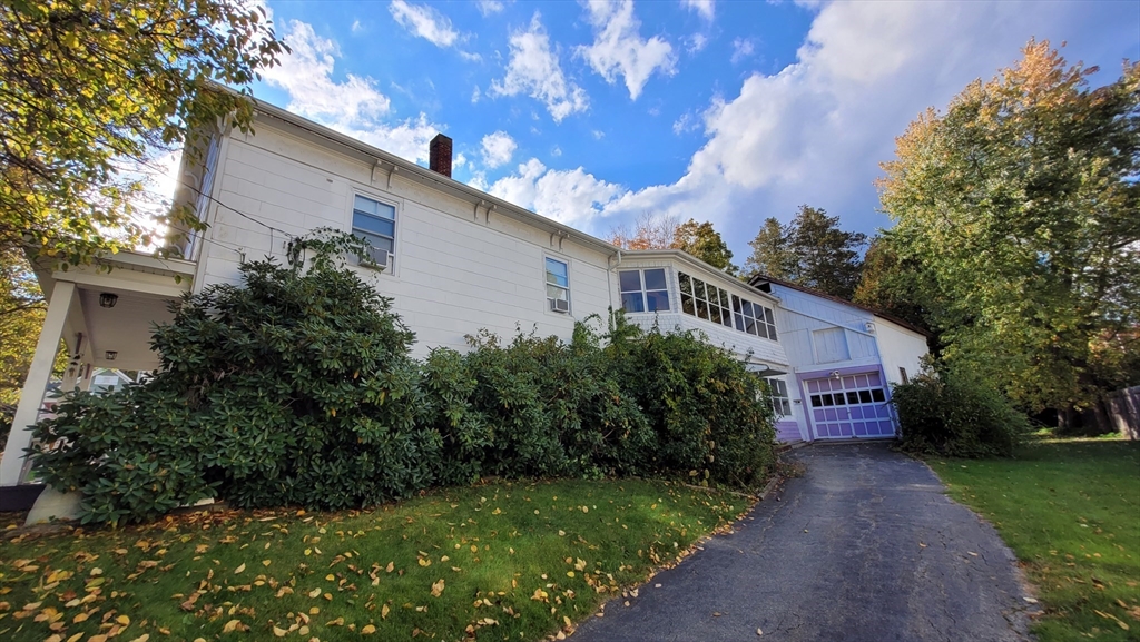 50 Grove Street Barre, MA 01005 - Photo 7 of 39 a view of a house with a yard and potted plants