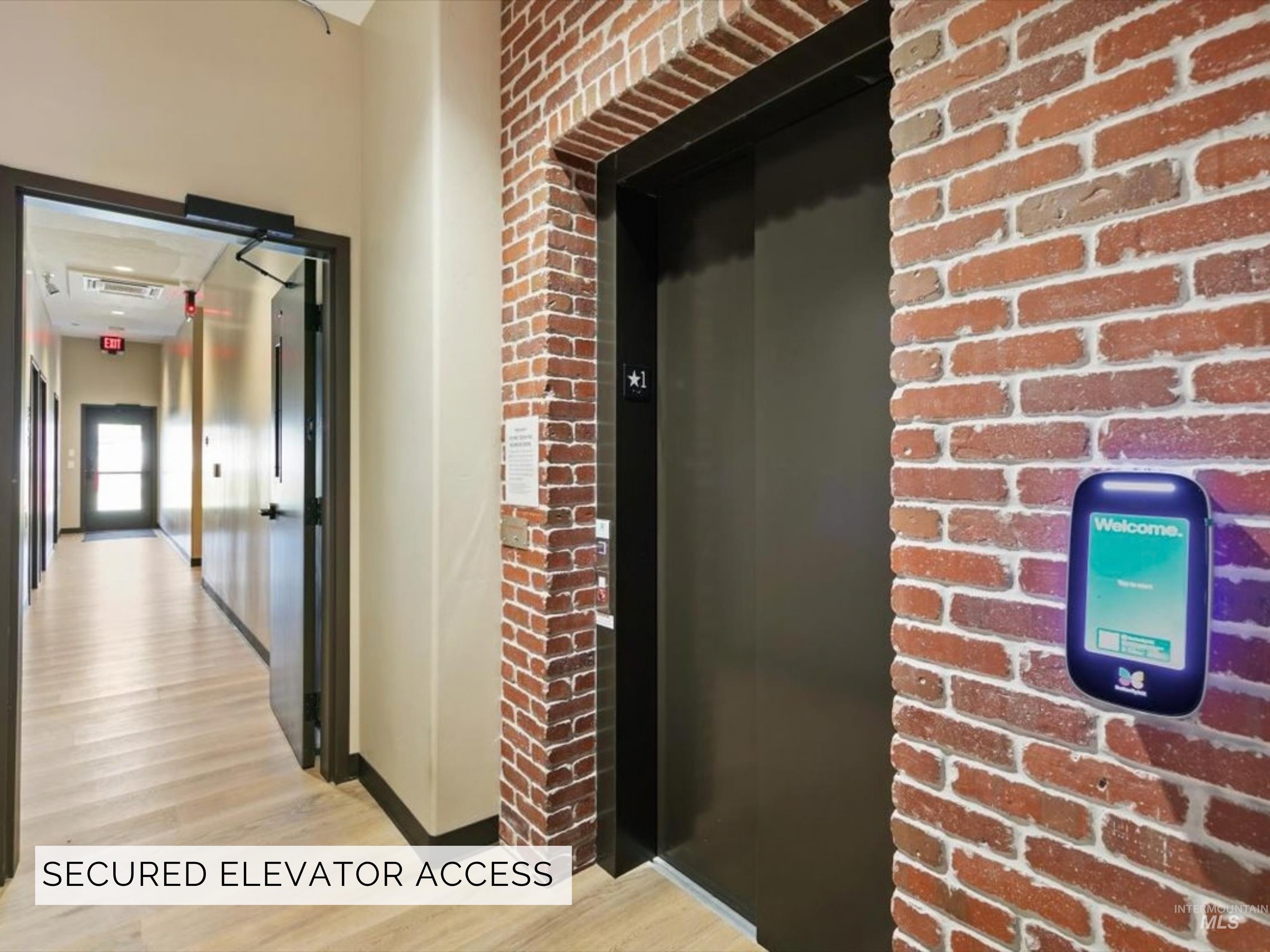 79 East Aikens Road, Unit 304 Eagle, ID 83616 - Photo 33 of 42 Exposed brick wall detailing, light wood-finish flooring, and contemporary elevator access