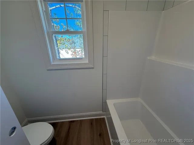 a bathroom with sink and window