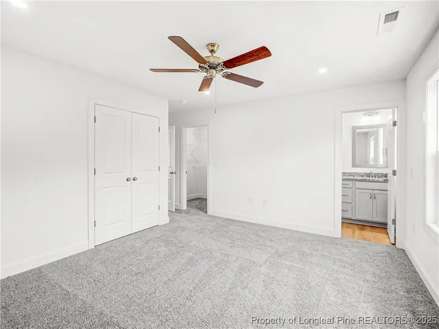 a view of a livingroom with a ceiling fan