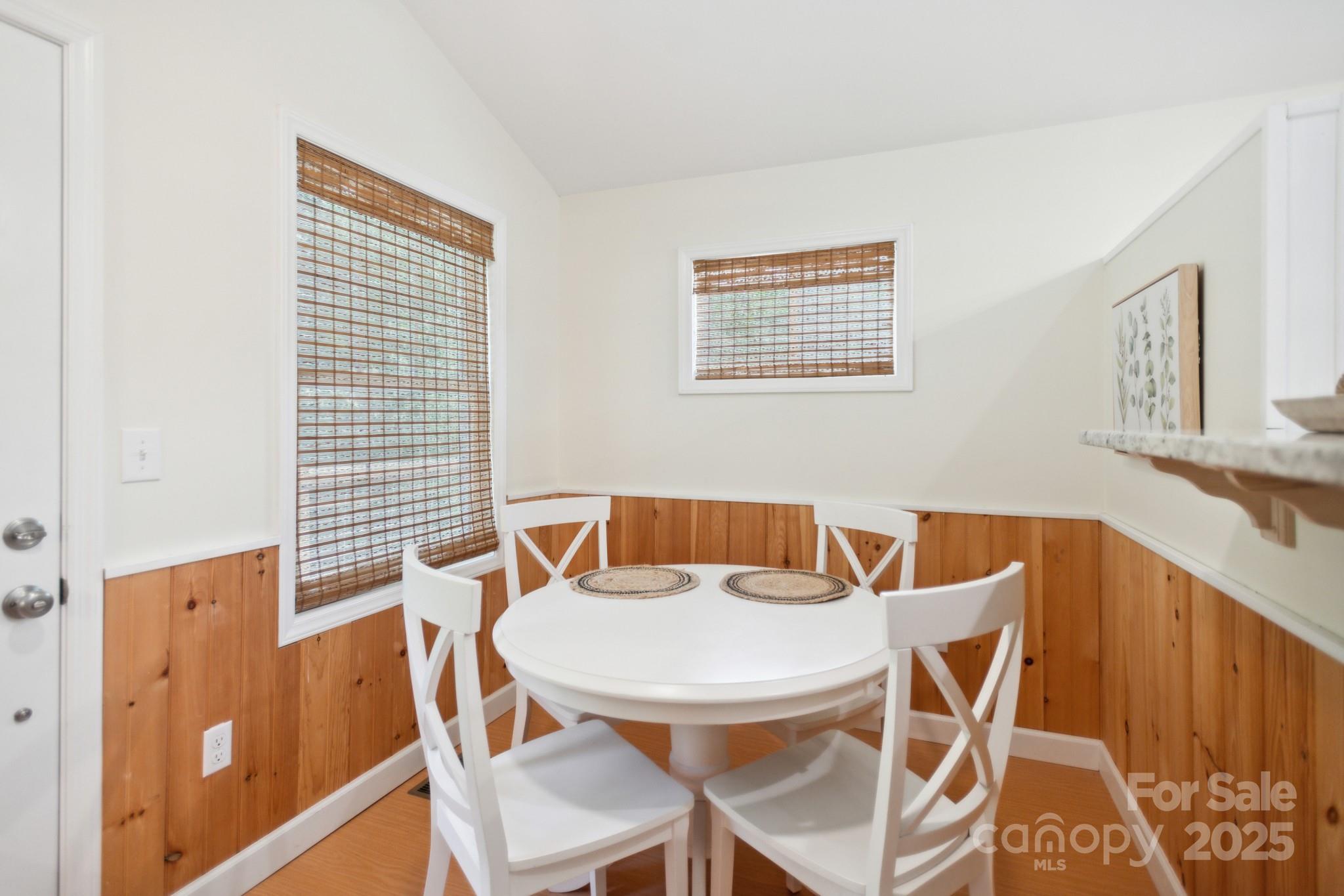 660 Pace Road Hendersonville, NC 28792 - Photo 11 of 31 a view of a dining room with furniture and wooden floor