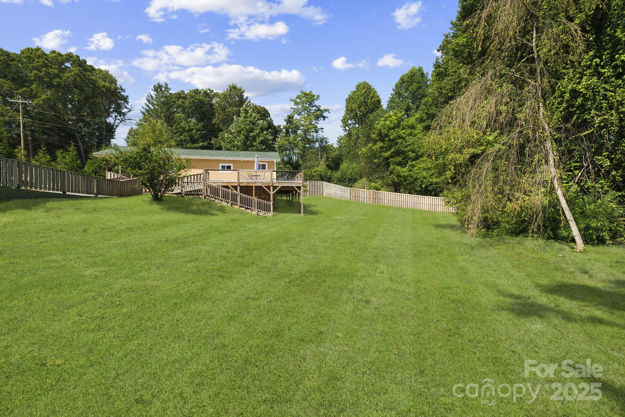 660 Pace Road Hendersonville, NC 28792 - Photo 14 of 31 a backyard of a house with table and chairs