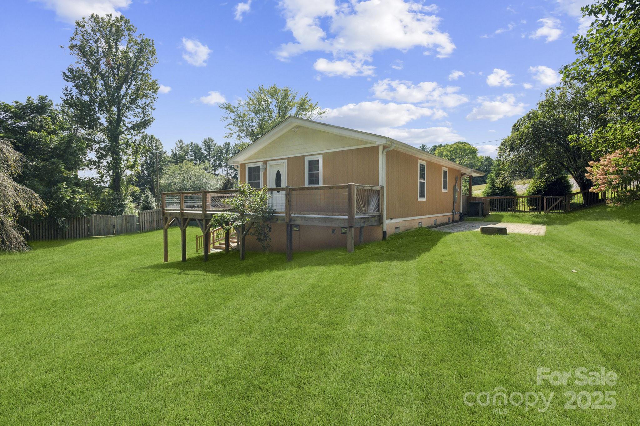 660 Pace Road Hendersonville, NC 28792 - Photo 15 of 31 a front view of a house with garden