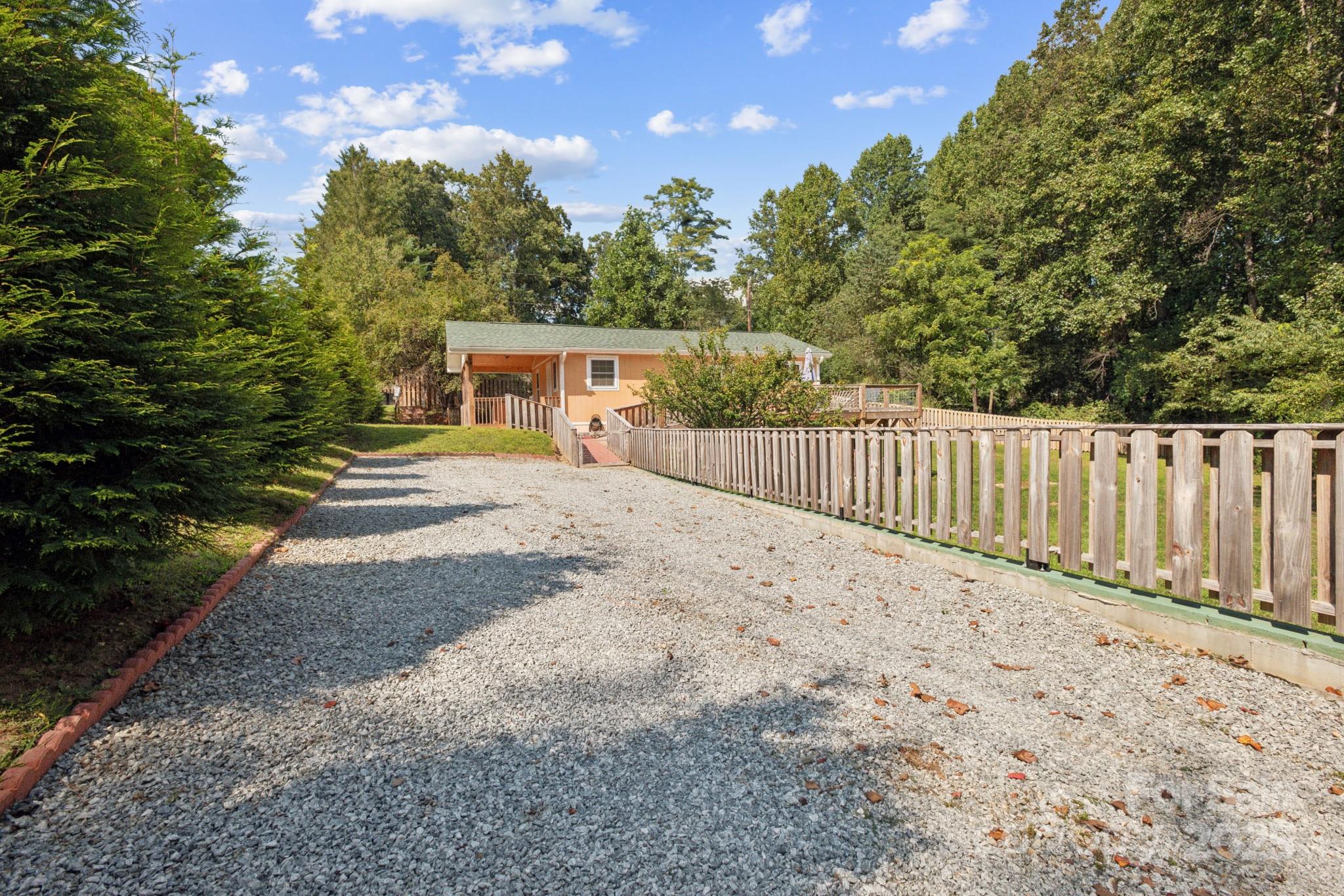 660 Pace Road Hendersonville, NC 28792 - Photo 20 of 31 a view of a backyard with wooden fence