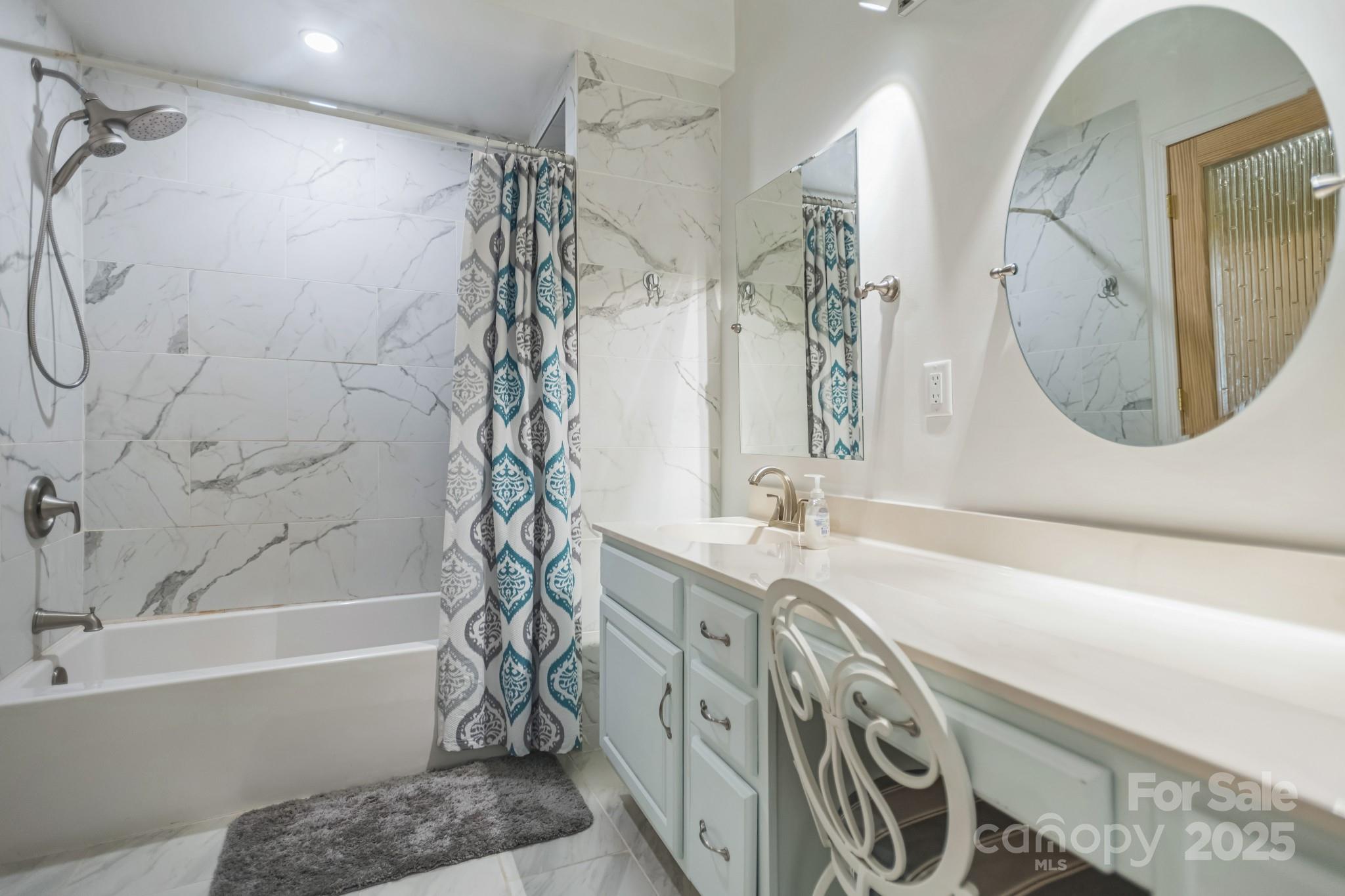 660 Pace Road Hendersonville, NC 28792 - Photo 6 of 31 a bathroom with a sink a toilet and a bathtub