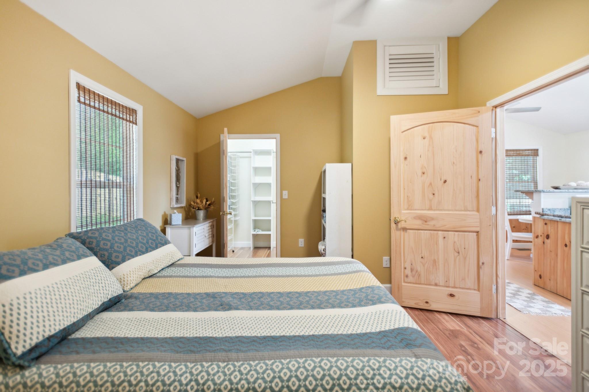 660 Pace Road Hendersonville, NC 28792 - Photo 8 of 31 a spacious bedroom with a large bed and furniture