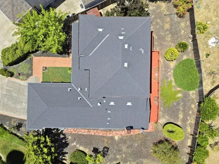 an aerial view of a house with a garden