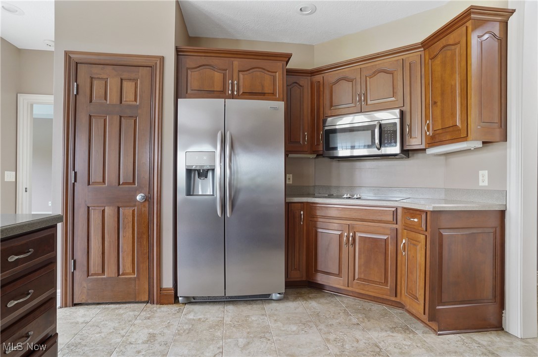5952 Beach Road Wadsworth, OH 44281 - Photo 12 of 40 Kitchen featuring appliances with stainless steel finishes and cherry cabinets