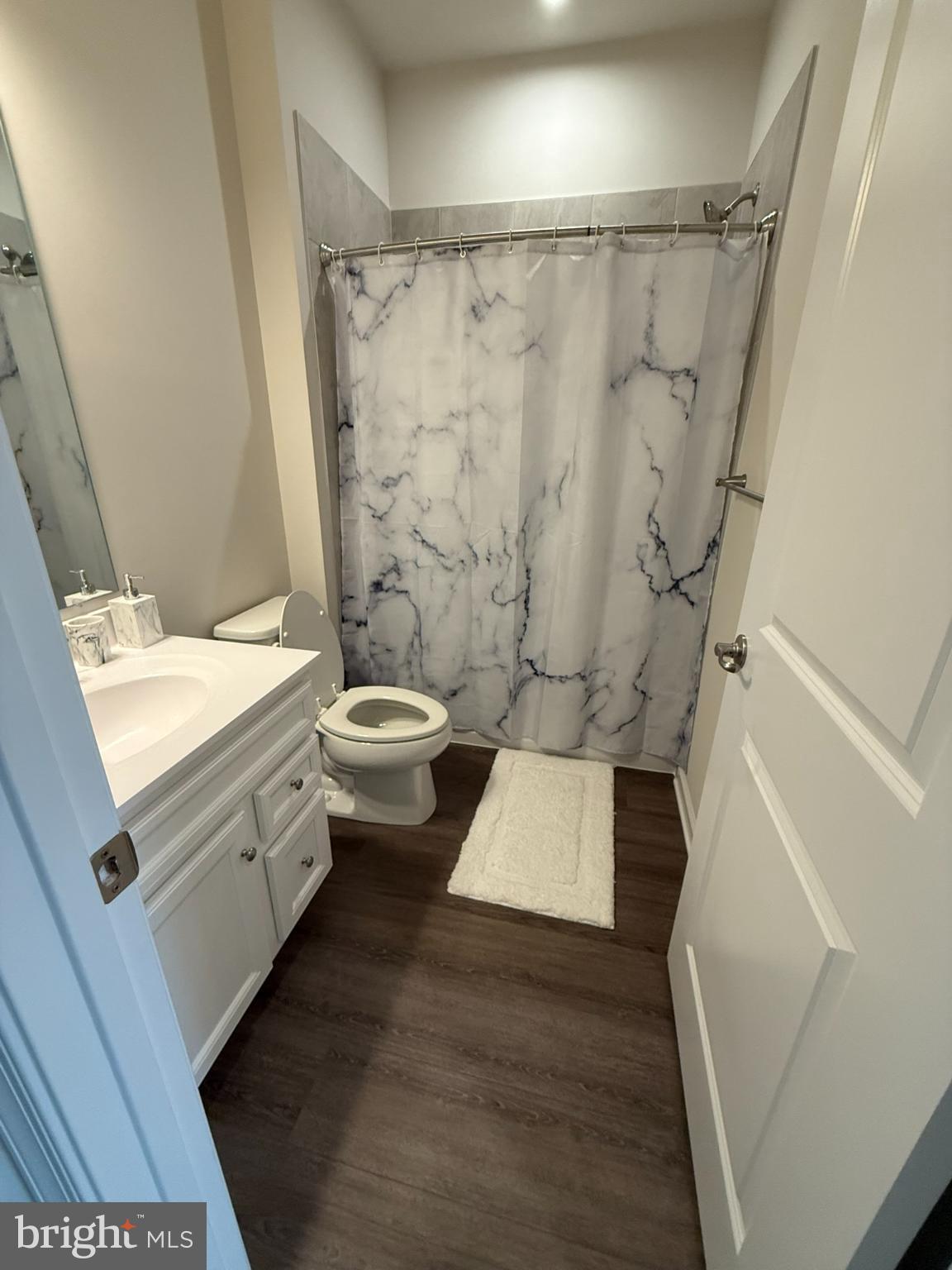 7891 Brandy Station Road Hanover, MD 21076 - Photo 19 of 25 Modern bathroom with elegant marble accents.
