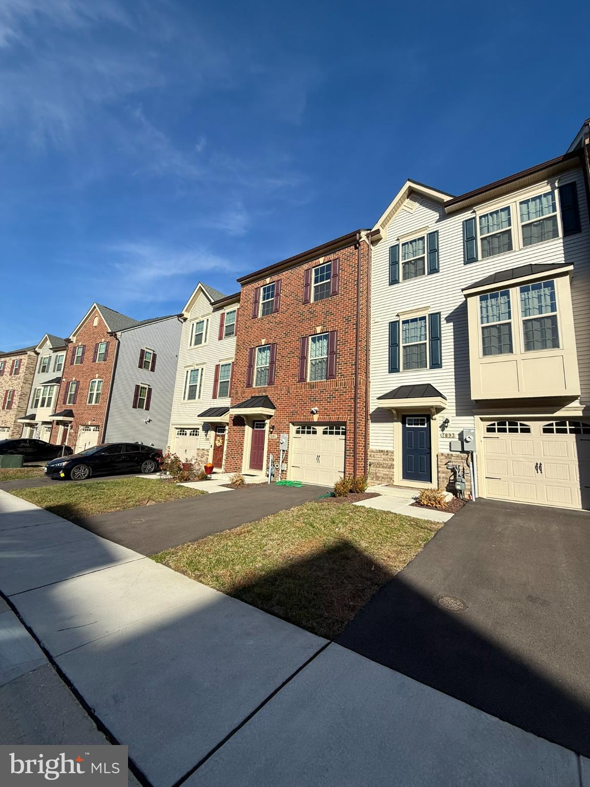 7891 Brandy Station Road Hanover, MD 21076 - Photo 2 of 25 Charming townhomes under a bright sky.