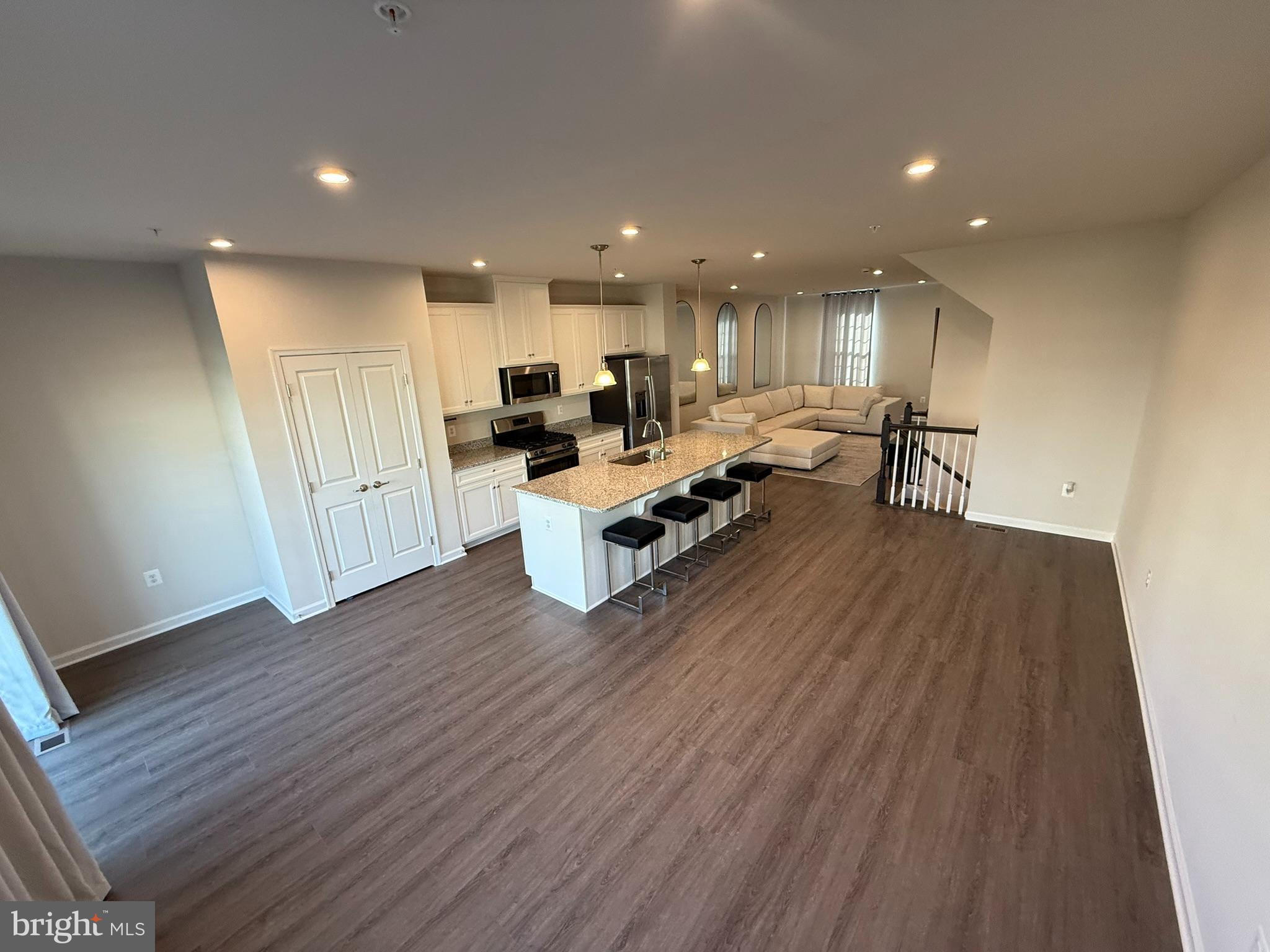 7891 Brandy Station Road Hanover, MD 21076 - Photo 4 of 25 Spacious modern living area with sleek design.