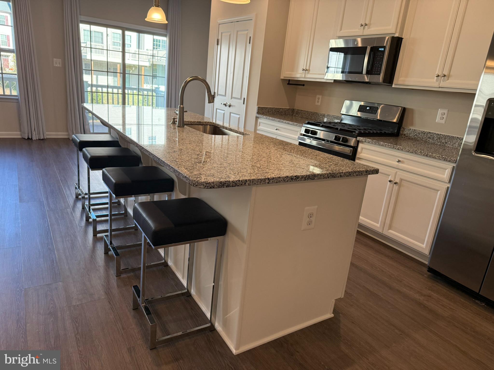 7891 Brandy Station Road Hanover, MD 21076 - Photo 6 of 25 Modern kitchen with sleek island seating.