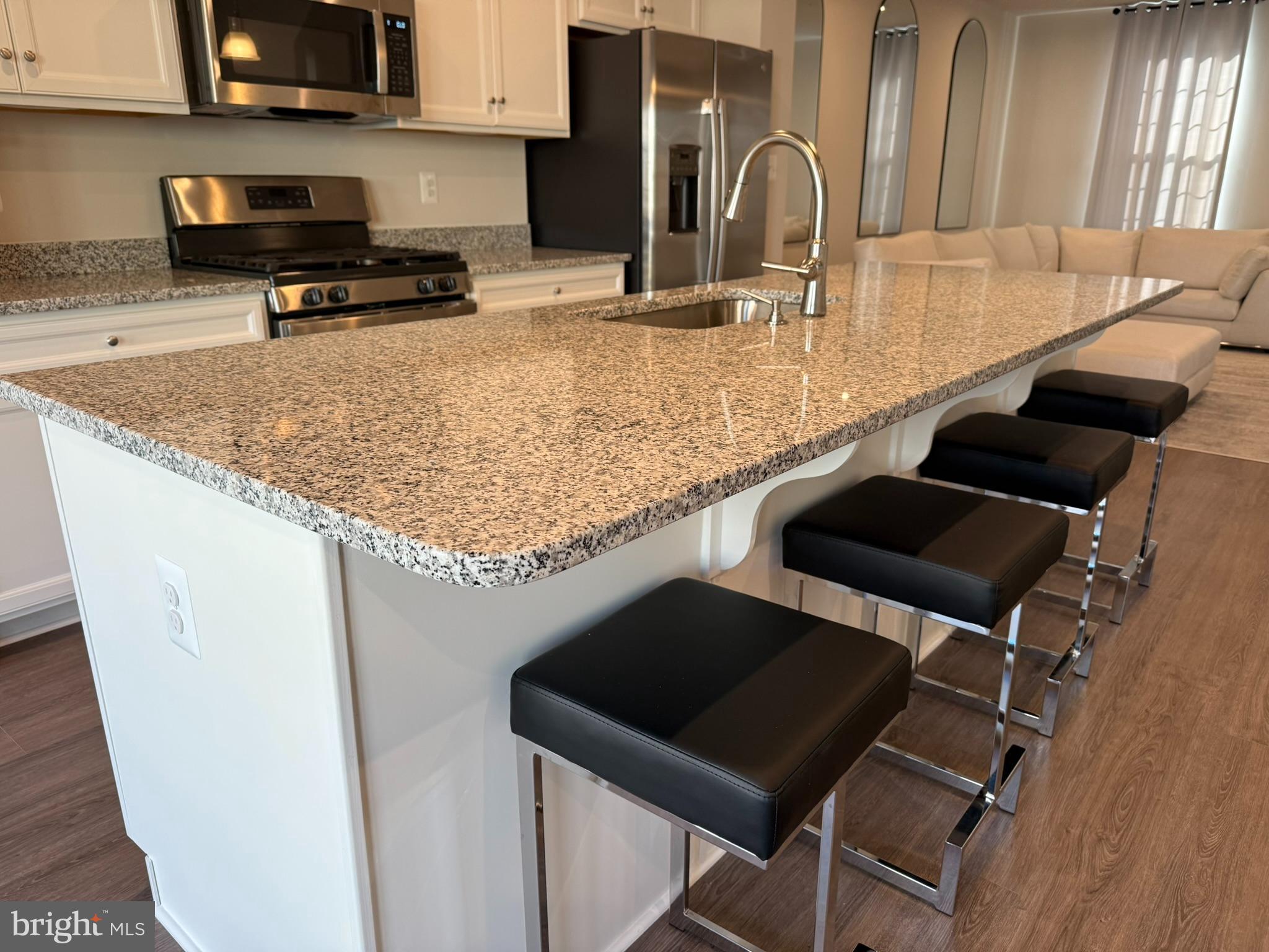 7891 Brandy Station Road Hanover, MD 21076 - Photo 7 of 25 Sleek kitchen with modern granite island.
