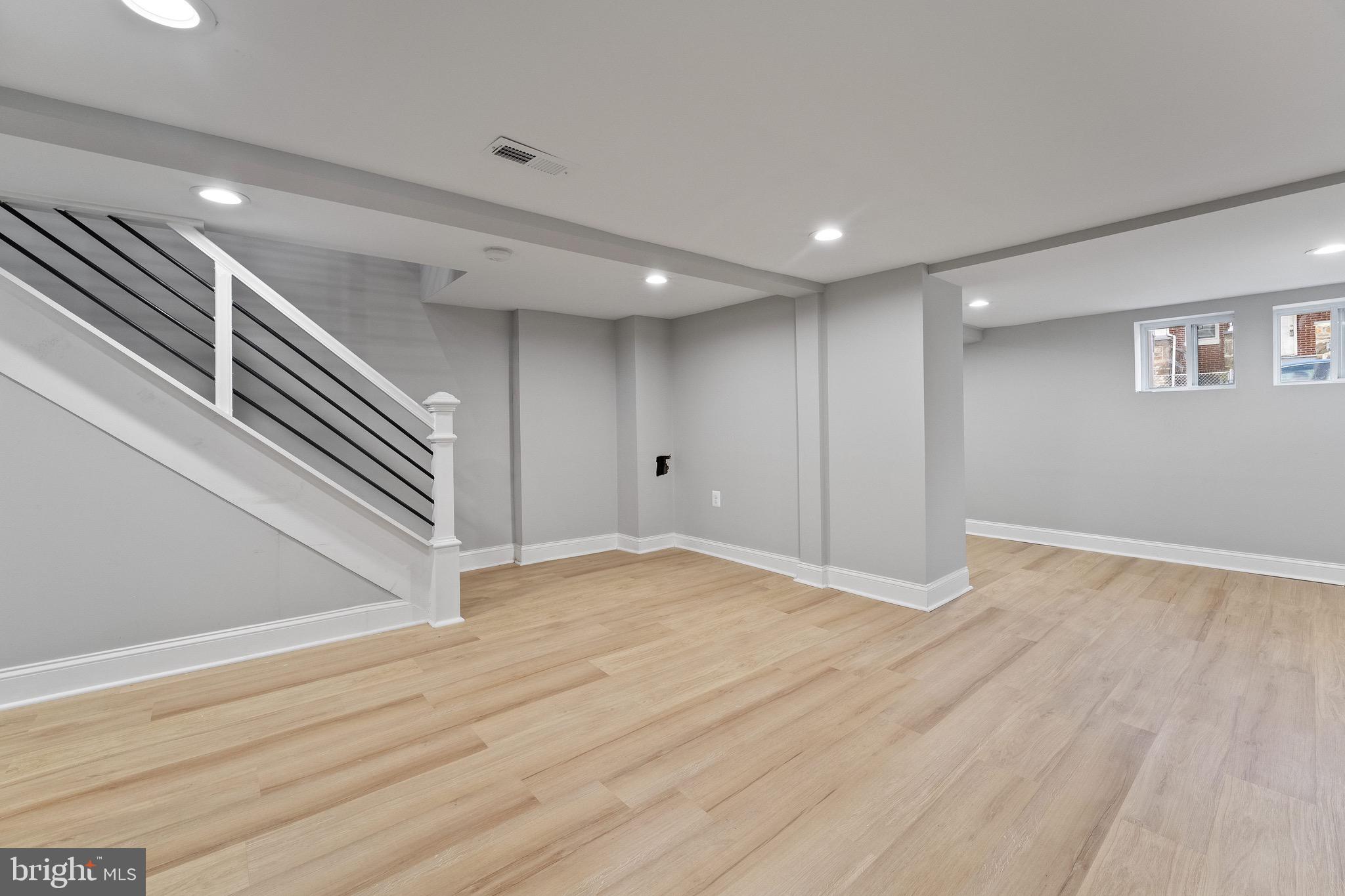 655 Dumbarton Avenue Baltimore, MD 21218 - Photo 12 of 28 a view of empty room with wooden floor
