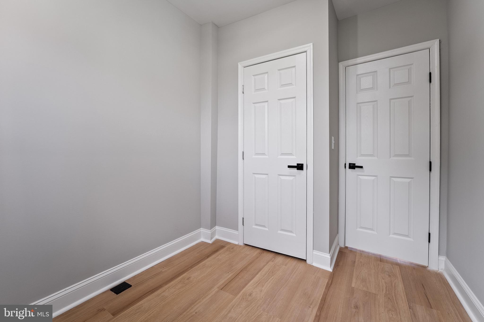 655 Dumbarton Avenue Baltimore, MD 21218 - Photo 21 of 28 a view of room with wooden floor
