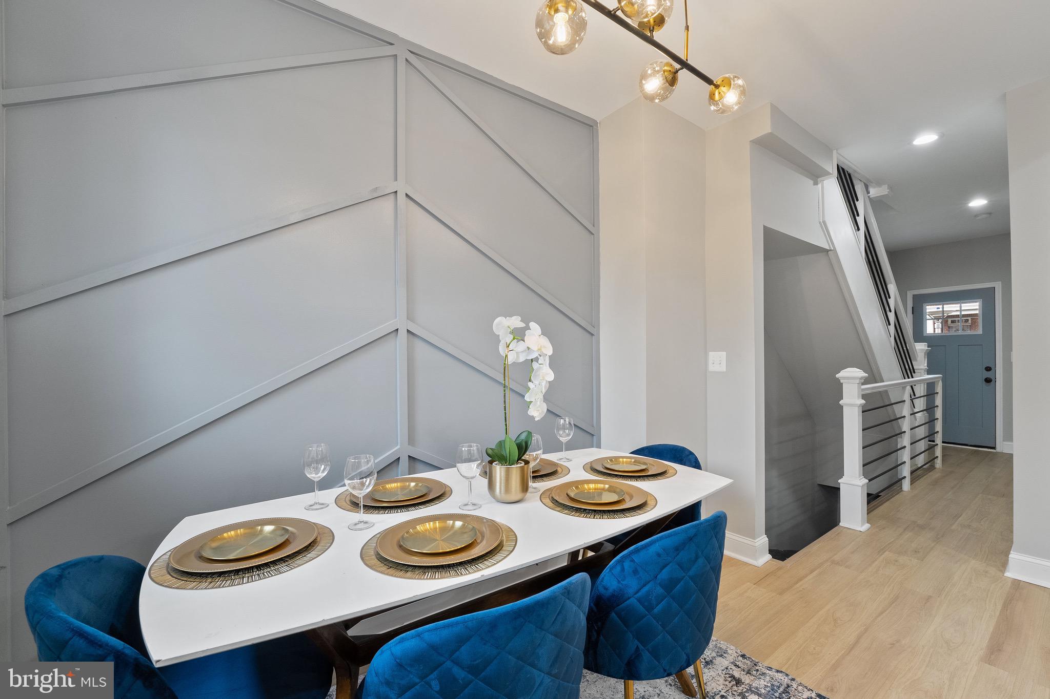 655 Dumbarton Avenue Baltimore, MD 21218 - Photo 24 of 28 a kitchen that has a table and chairs in it