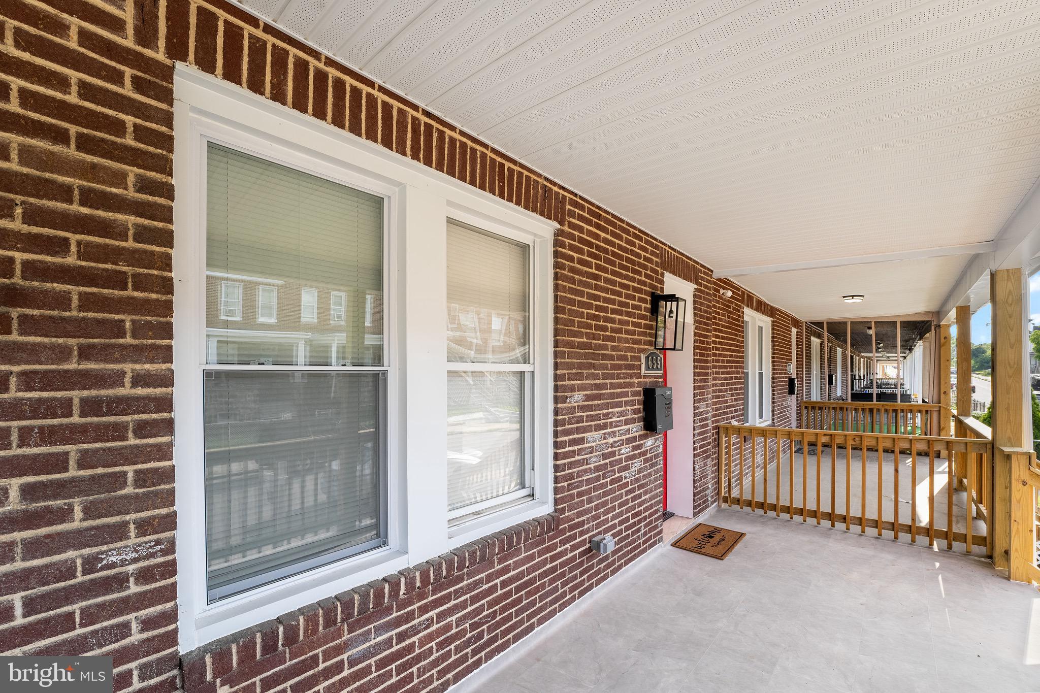 655 Dumbarton Avenue Baltimore, MD 21218 - Photo 26 of 28 a view of a balcony with door