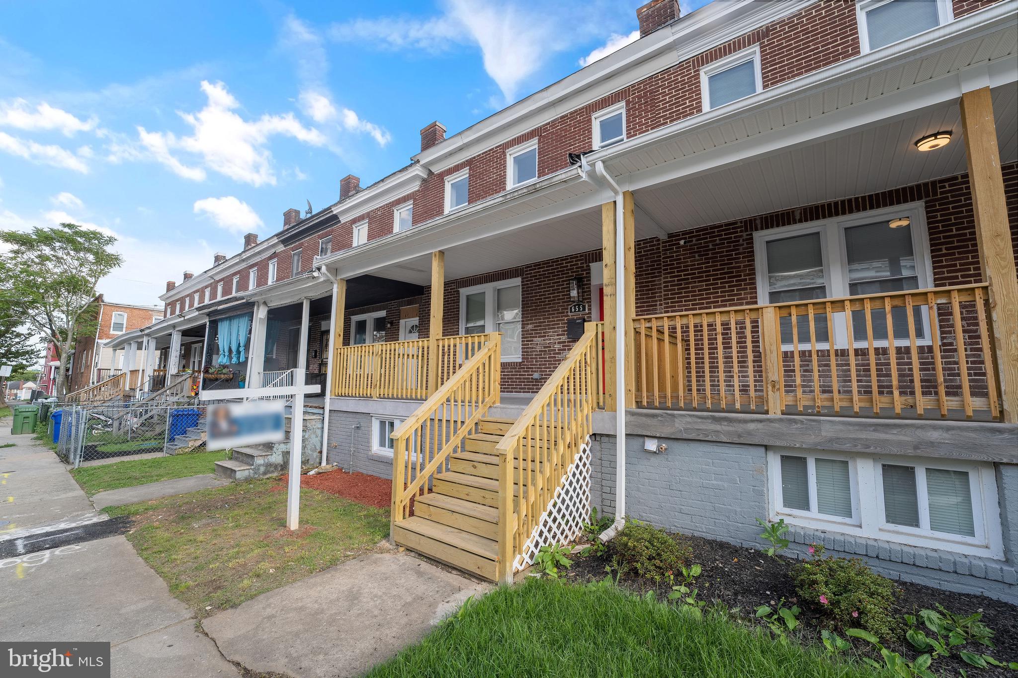 655 Dumbarton Avenue Baltimore, MD 21218 - Photo 27 of 28 a view of a house with a yard
