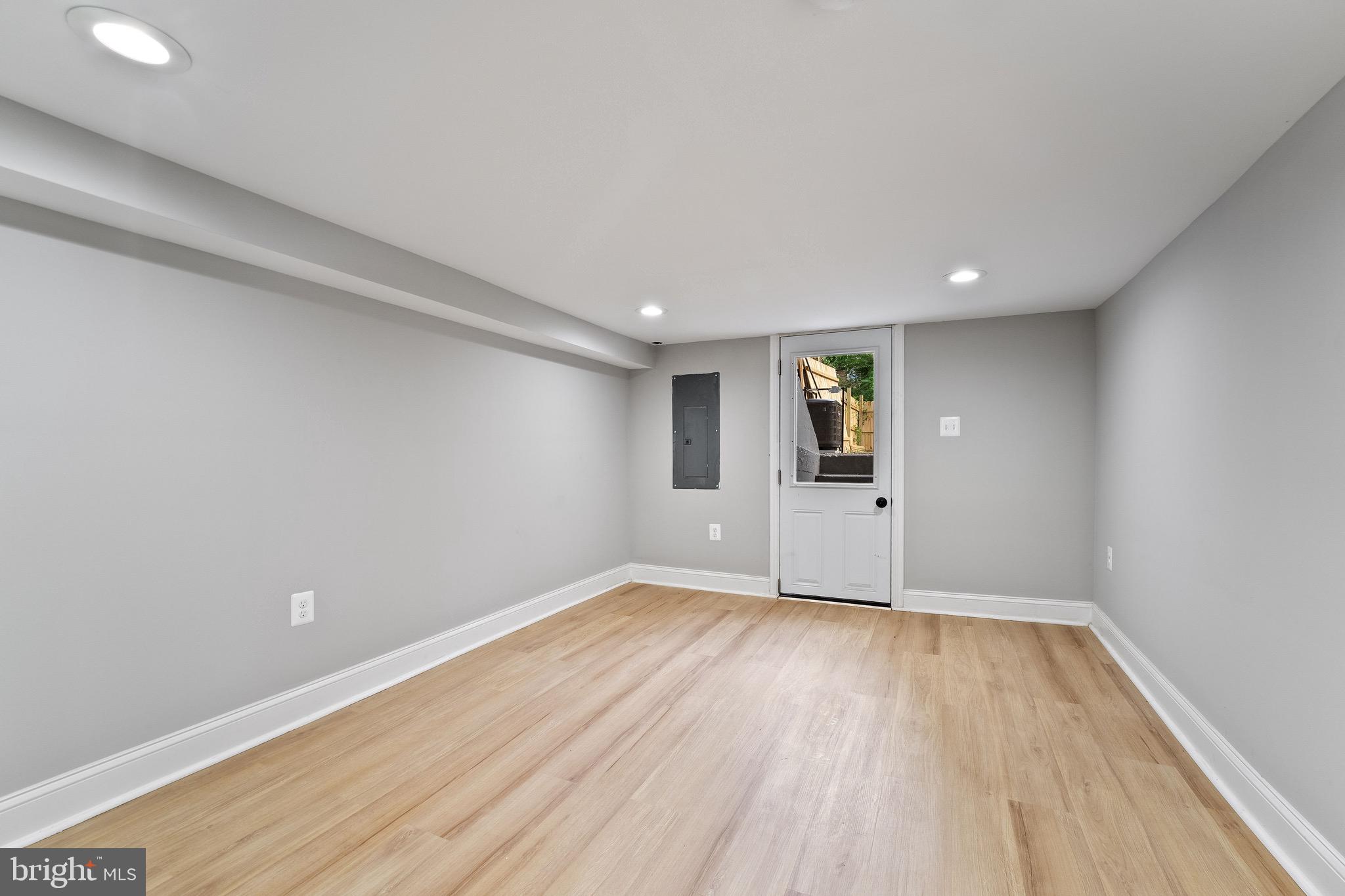 655 Dumbarton Avenue Baltimore, MD 21218 - Photo 10 of 28 a view of empty room with wooden floor