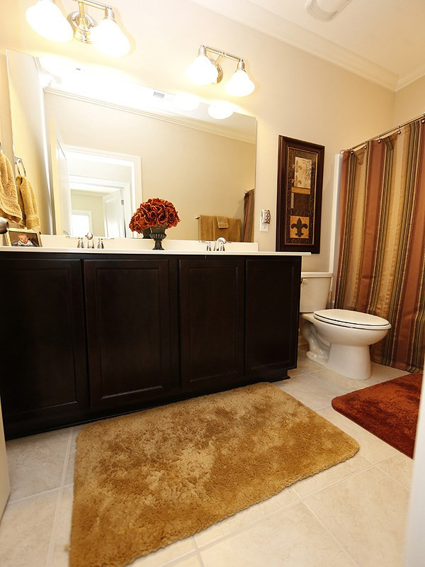 1145 Chapanoke Road Raleigh, NC 27603 - Photo 22 of 25 The upstairs bath has 2 sinks and a tub/shower. Bathroom