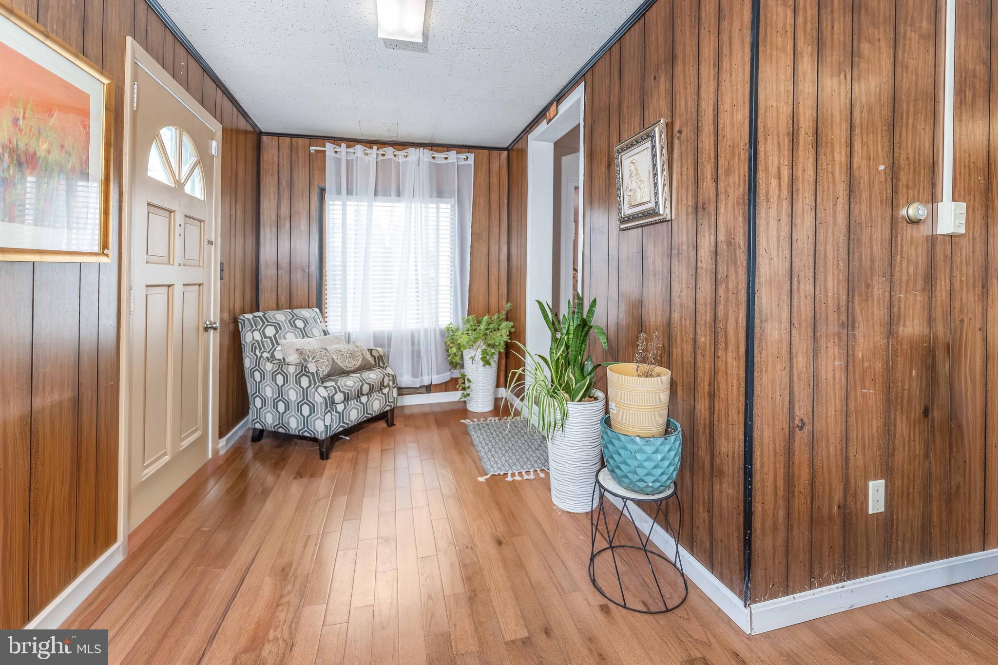 136 Linglestown Road Harrisburg, PA 17110 - Photo 14 of 25 a room with lots of potted plants and wooden floor