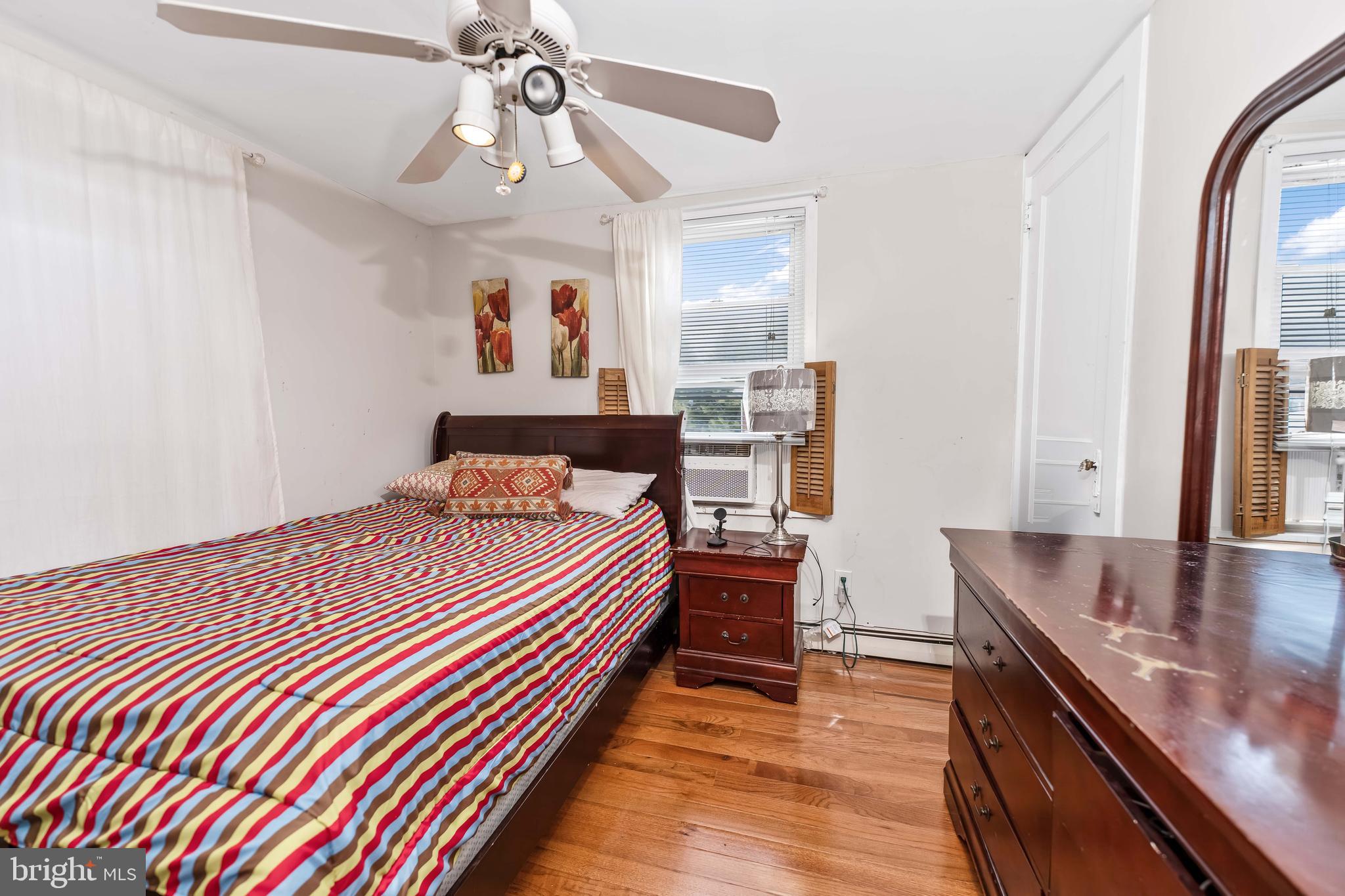 136 Linglestown Road Harrisburg, PA 17110 - Photo 17 of 25 a bed room with a bed and a chandelier